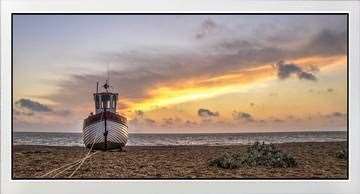 A framed print of Dungeness beach by Andy Smith Photography, whose work starts from £20