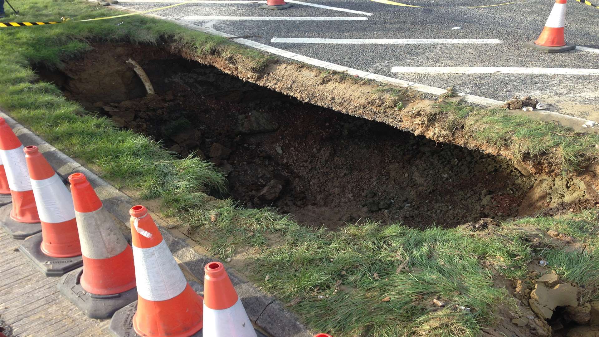 The gaping hole under the road
