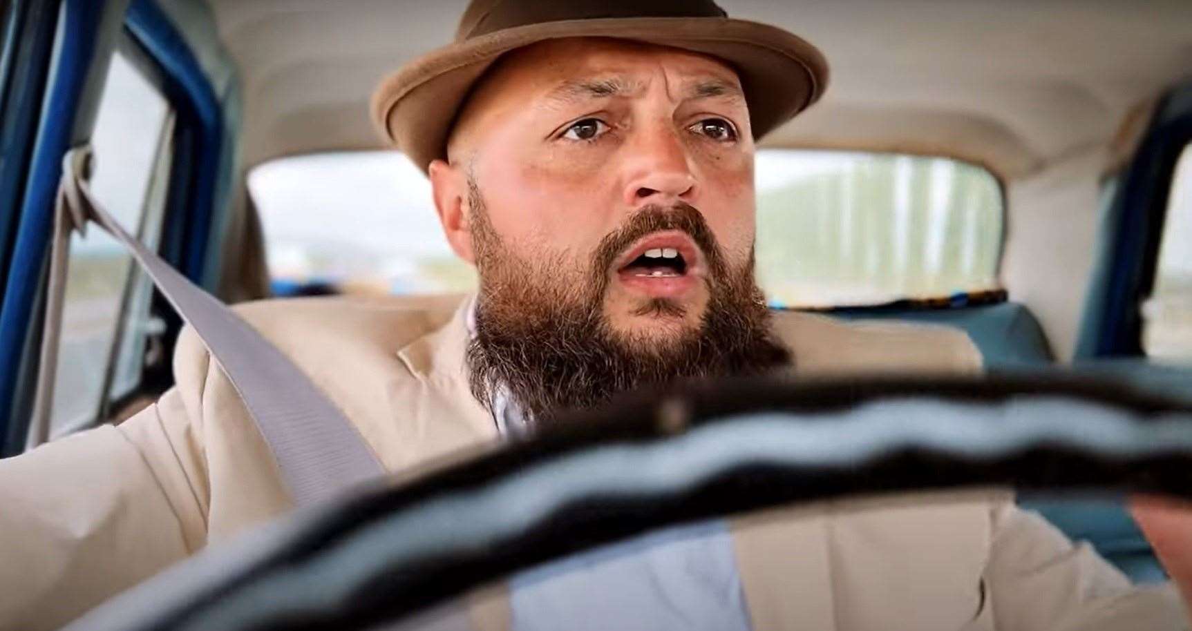 Bearded Maxwell driving his car in a scene from Capers, billed as Sheppey's first reality sitcom. Picture: Cooper-Gray Productions