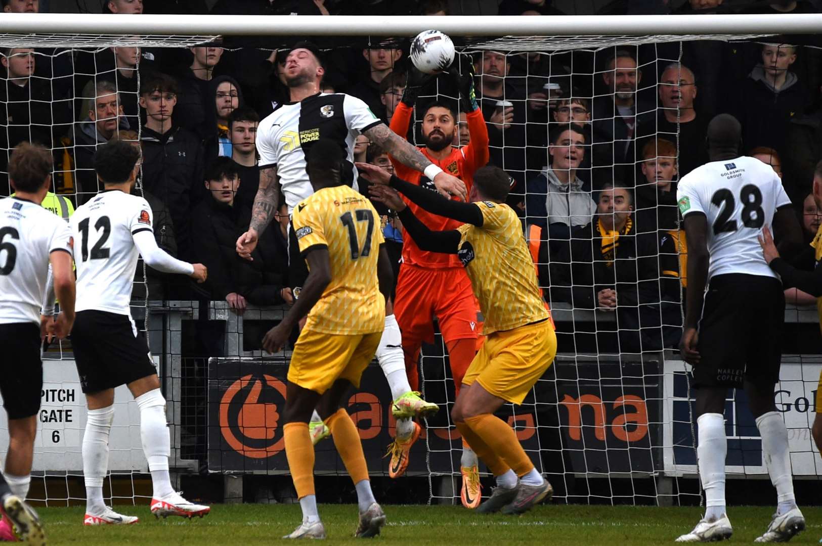 Maidstone keeper Lucas Covolan claims a cross. Picture: Steve Terrell