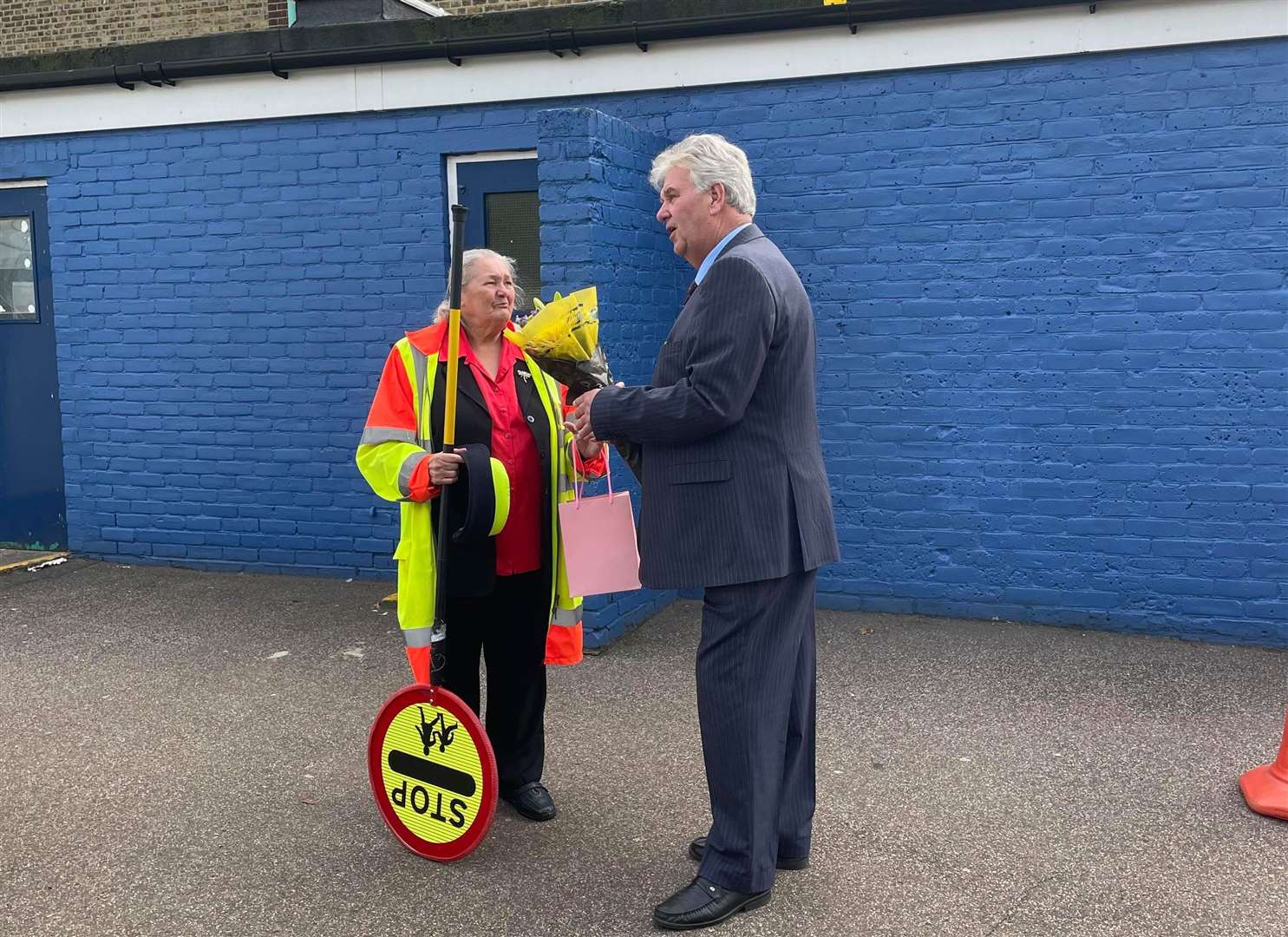 Medway lollipop lady Jenny Lewing has retired after 40 years with 37 at Barnsole Primary School in Gillingham. Cabinet member for frontline services Cllr Phil Filmer presents Jenny with a retirement gift and thanks her for her service. Picture: Medway Council