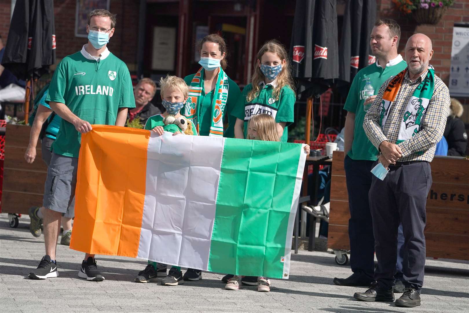 The Wilson family wait for the funeral cortege (Owen Humphreys/PA)