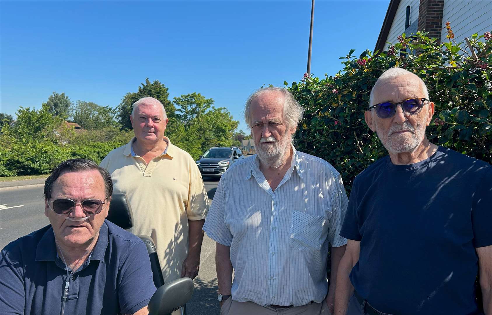 (Left to right) Cllr Tony Cooper, Graham Merry, John Williams and Dennis Beer are calling for yellow lines to be painted to stop people parking on Wraightsfield Avenue