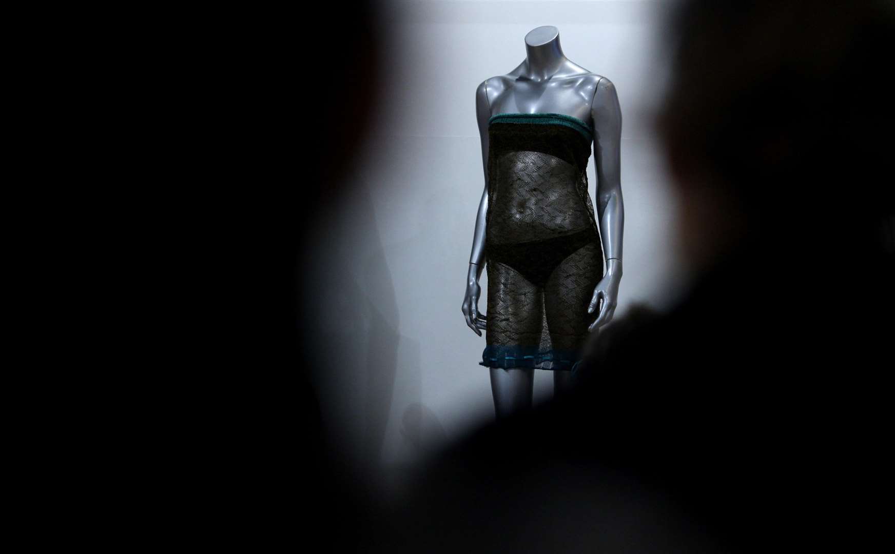 A transparent dress once worn by Kate Middleton at a charity fashion show at the University of St Andrews in 2002 which is thought to have been attended by William (Chris Radburn/PA)