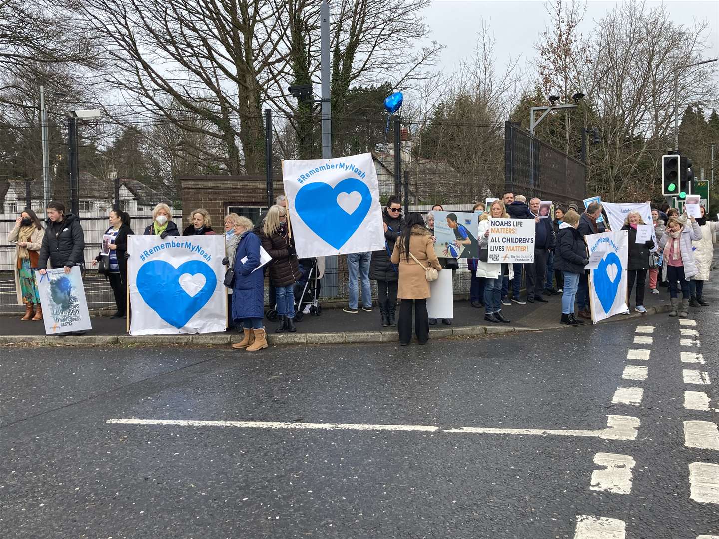 Supporters of Fiona Donohoe’s campaign for justice for her son Noah gather at PSNI headquarters in Belfast (Rebecca Black/PA)