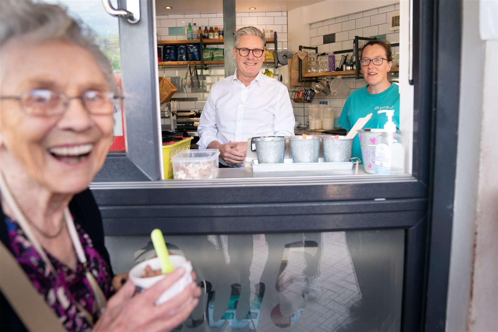 Sir Keir Starmer serves ice cream to day trippers on Barry seafront in South Wales after launching Labour’s six steps for change (Stefan Rousseau/PA)