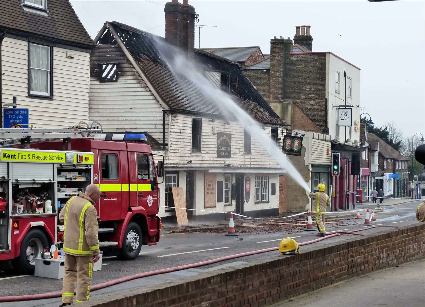 Firefighters hose down the Crispin and Crispianus pub in Strood after the fire in March 2011. Picture by William Shuter