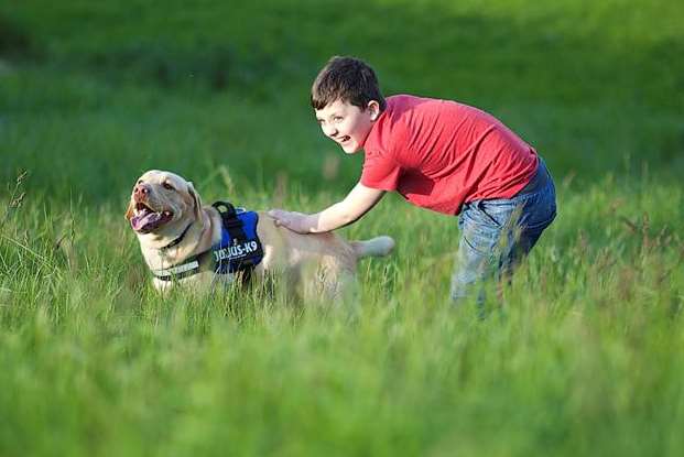 Jacob loves playing with Buddy in the park