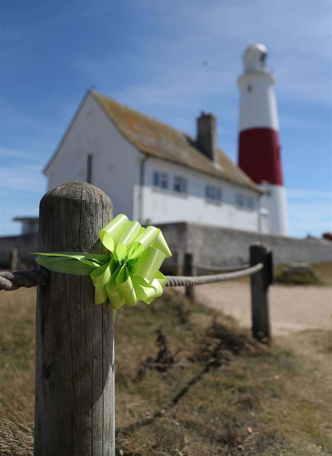 The family put up green Justice For Harry ribbons outside the lighthouse at Portland Bill (Andrew Matthews/PA)