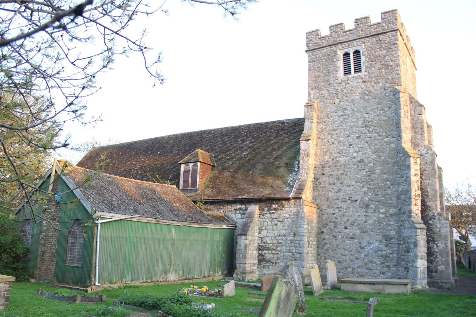 The vestry made of corrugated metal at the back of Queenborough church