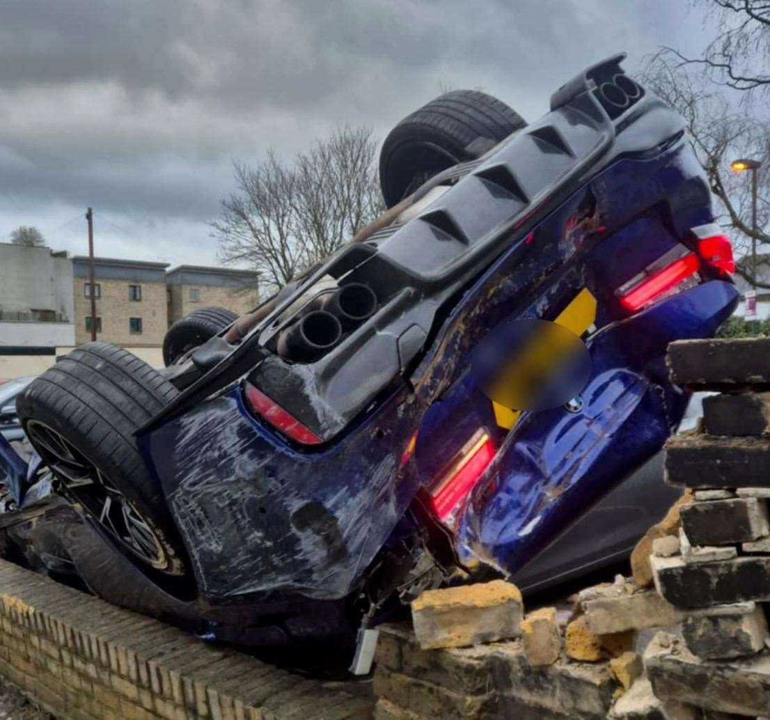 The BMW M5 on its roof after crashing in Overy Street in Dartford. Picture: Bradley Reynolds