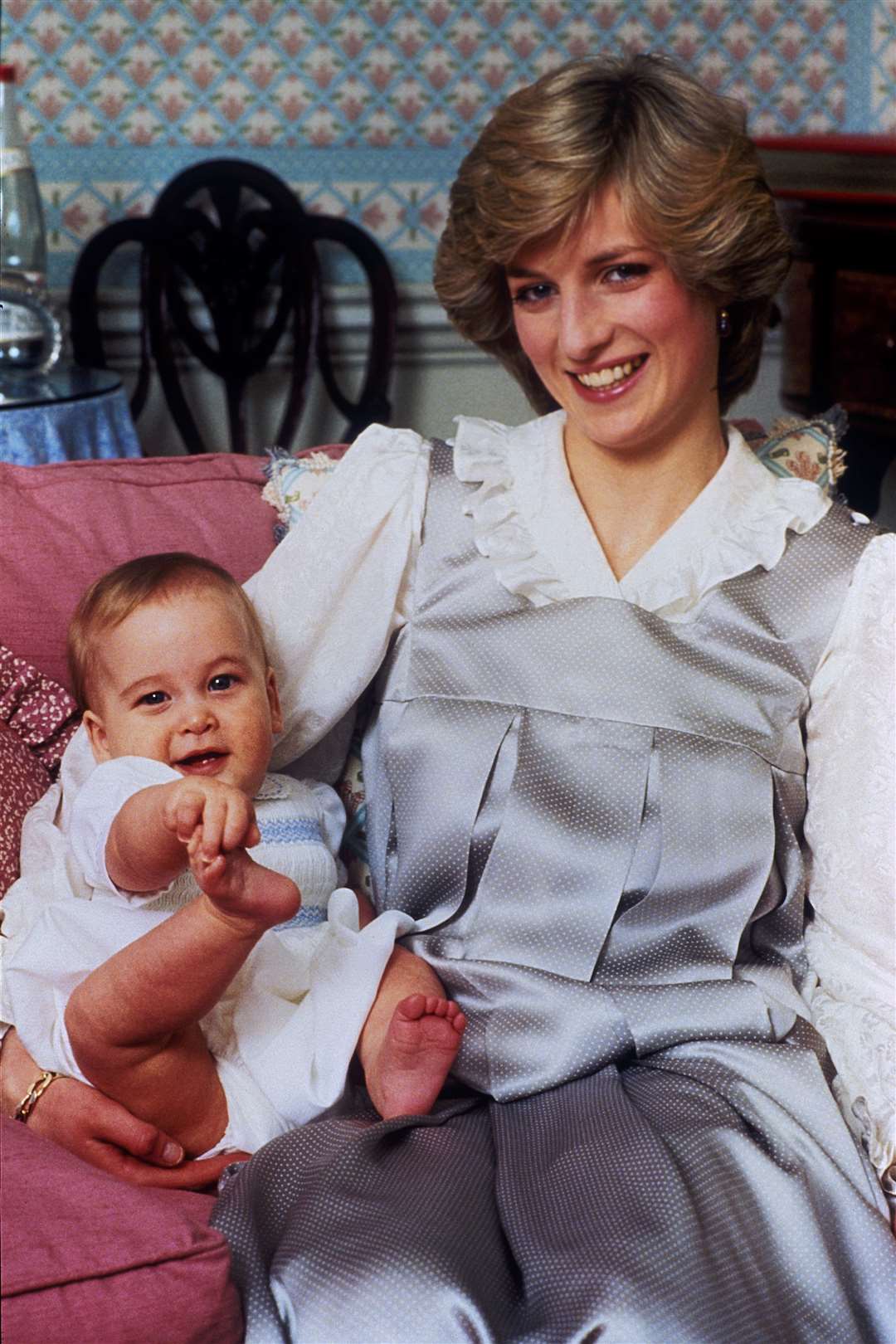 A baby Prince William with his mother the Princess of Wales in 1983 (PA)