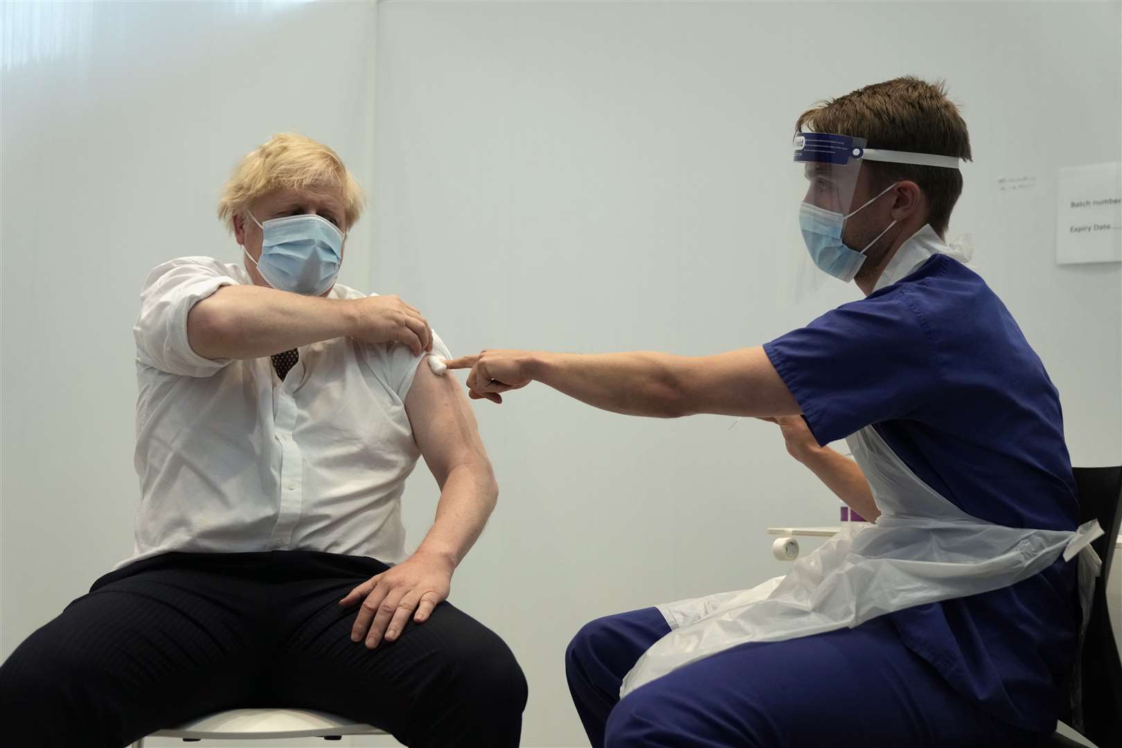 Mr Johnson receives his second jab of the AstraZeneca coronavirus vaccine from James Black, at the Francis Crick Institute in London (Matt Dunham/PA)