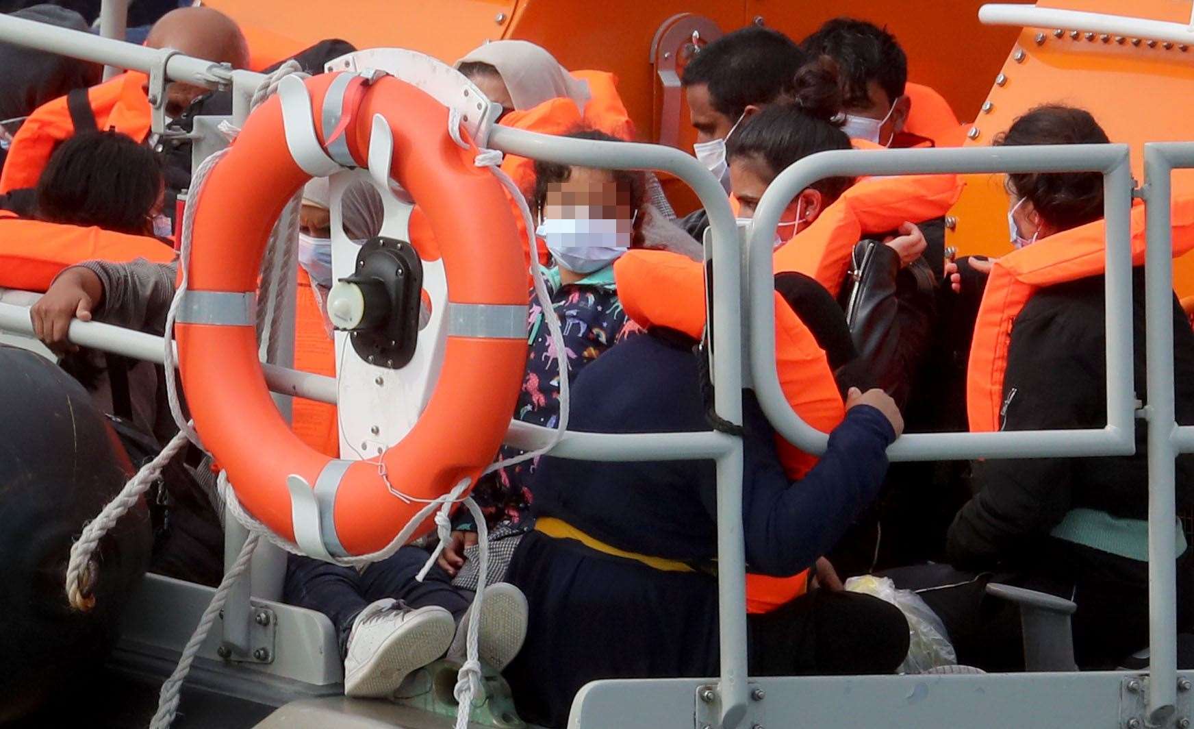 A group of people thought to be migrants are brought into Dover (Gareth Fuller/PA)