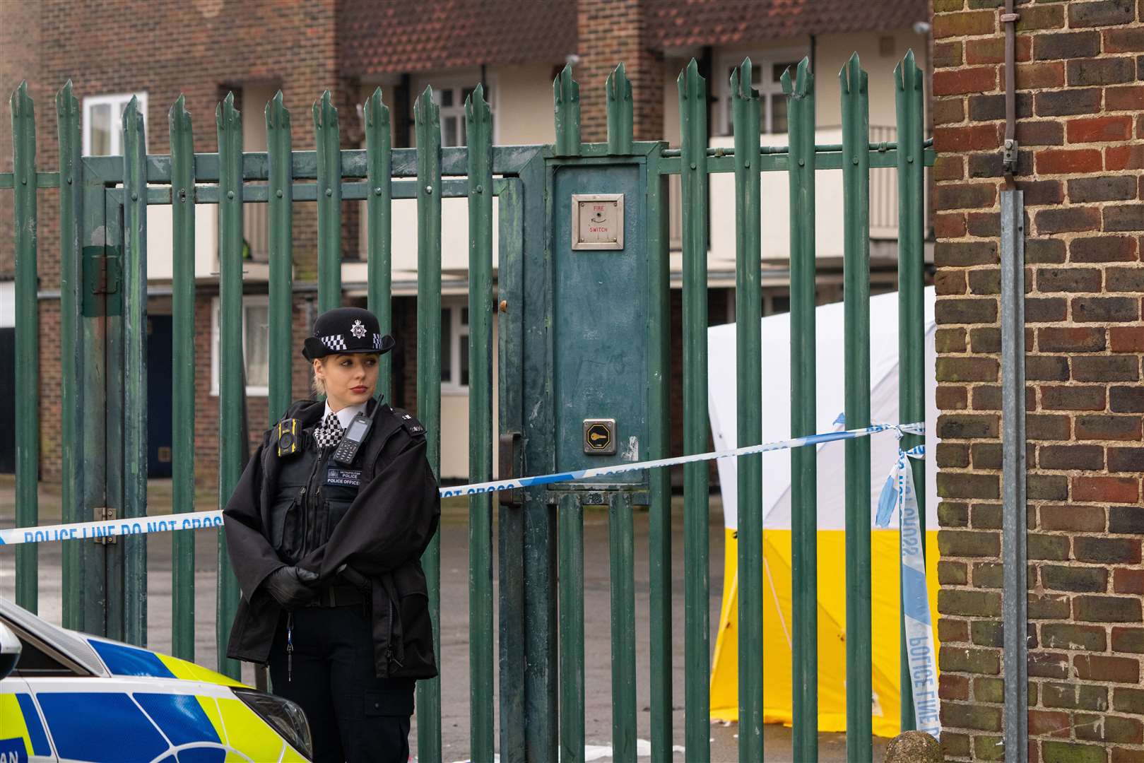 A police officer at the scene of a fatal stabbing at flats on Wisbeach Road (Dominic Lipinski/PA)