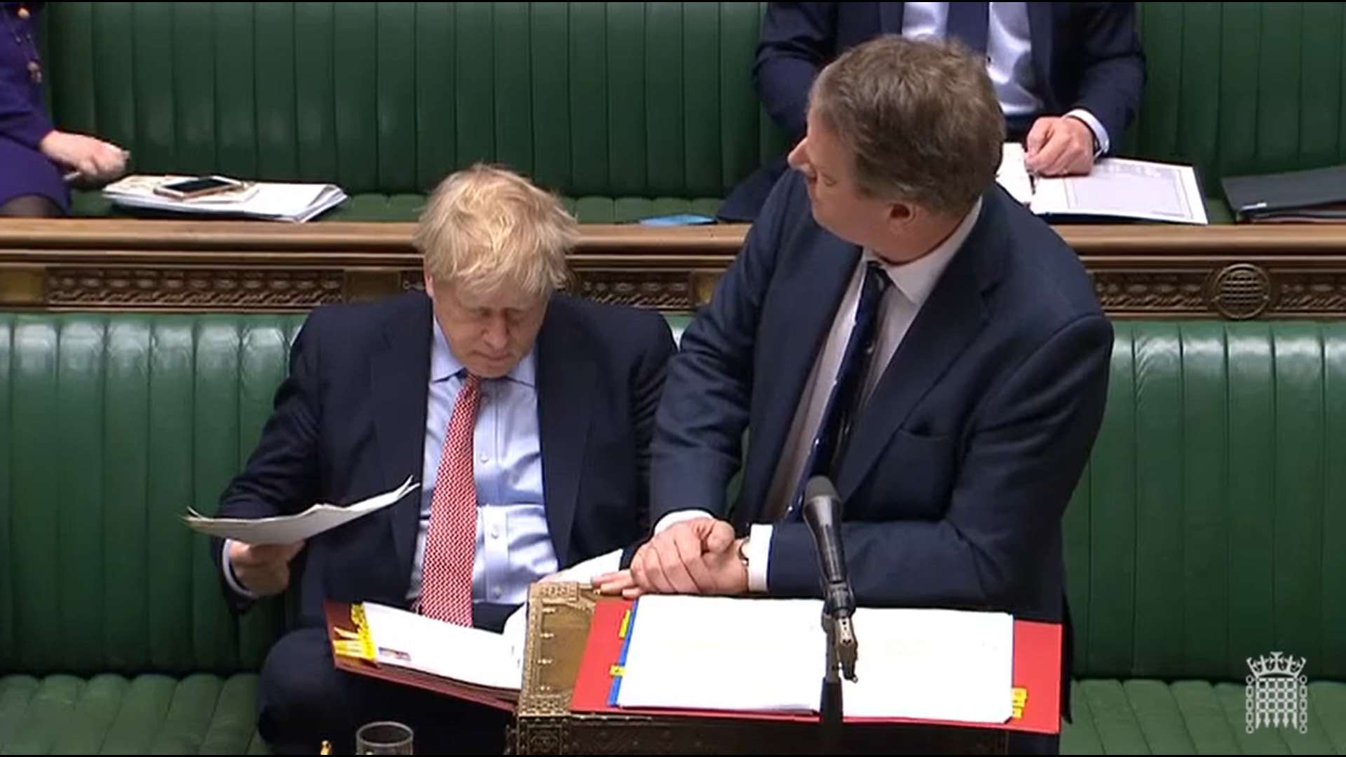 Mr Johnson in the Commons on March 25 near Secretary of State for Scotland Alister Jack, who also suffered symptoms of Covid-19 (House of Commons/PA)