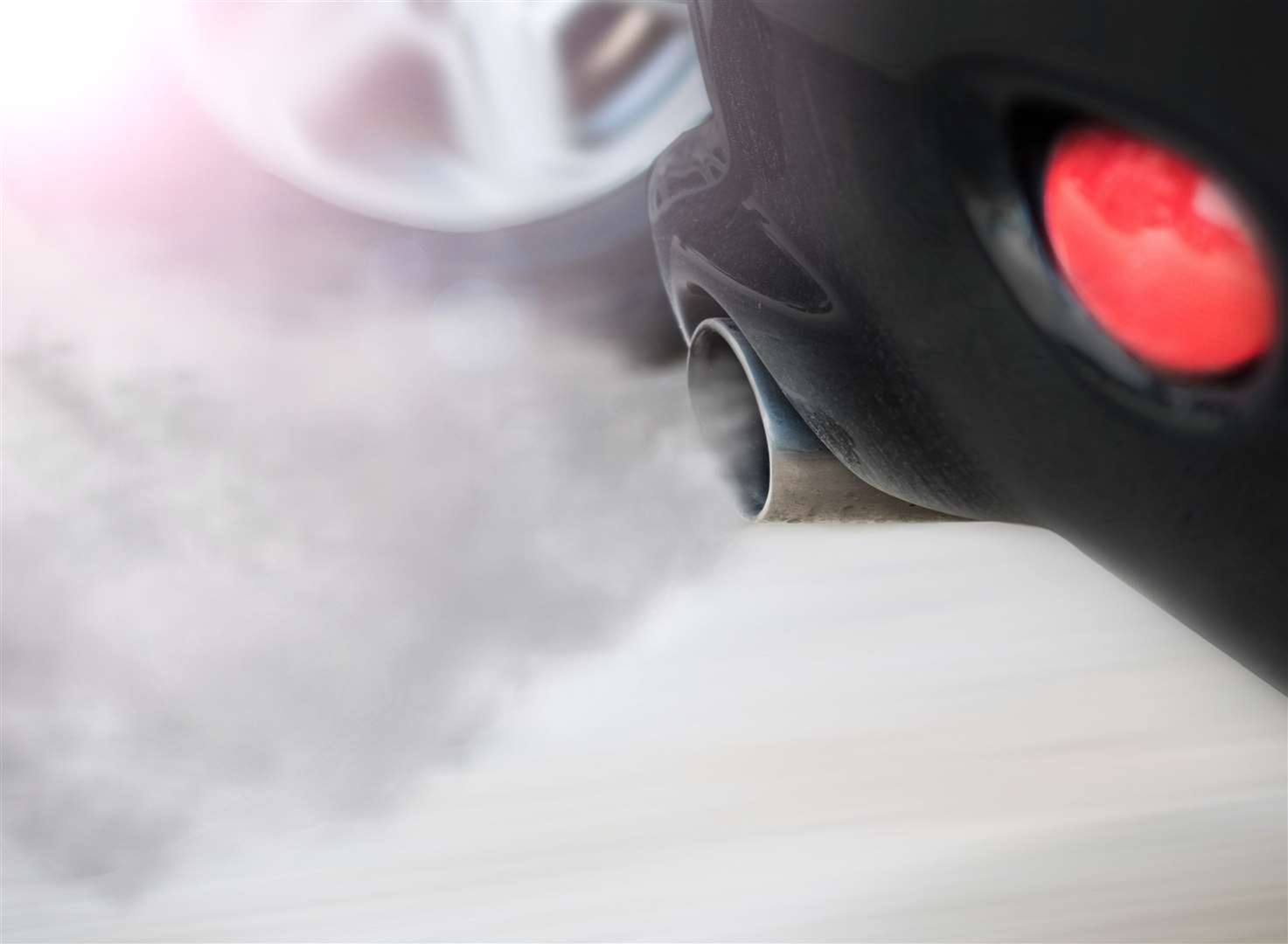 Air pollution from car exhaust pipe. Stock picture