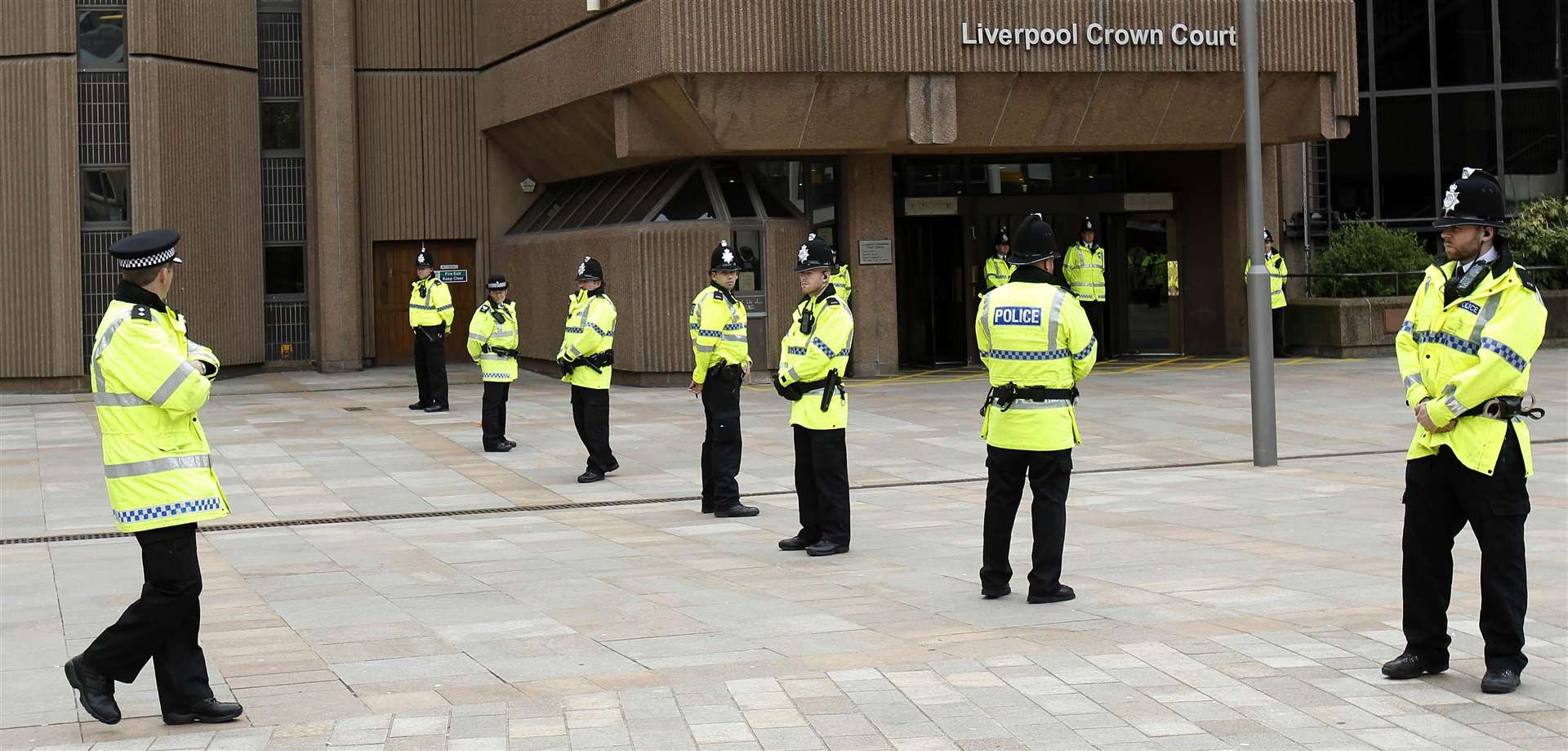 Merseyside Police officers outside Liverpool Crown Court, during the trial of nine men from Rochdale accused of child sex grooming in 2012 (Peter Byrne PA)