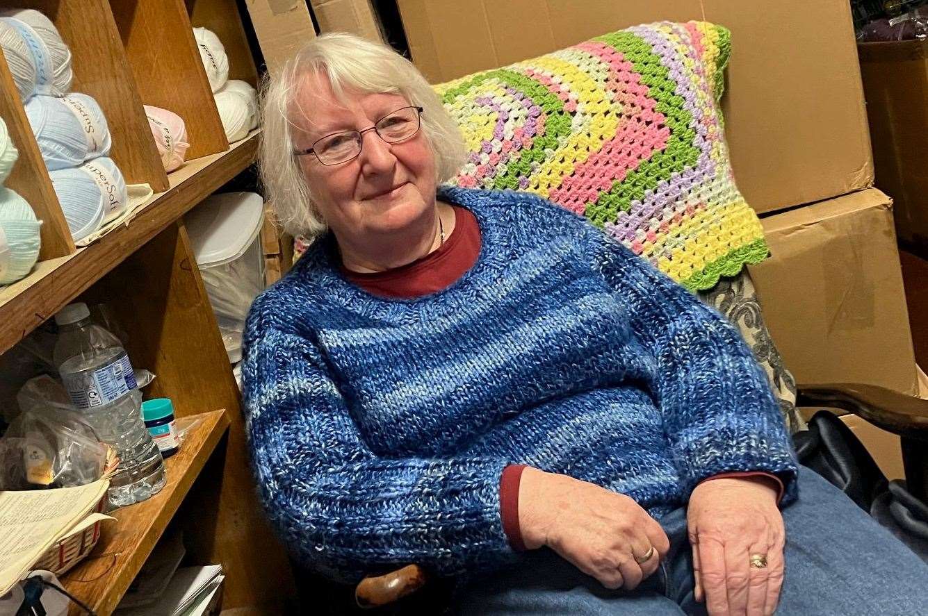 Eve Kings sits in the stock room of her Queen Street shop