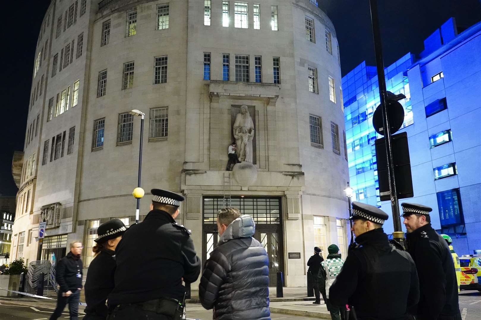 Police and emergency services are at the scene trying to coax the man to come down (Ian West/PA)