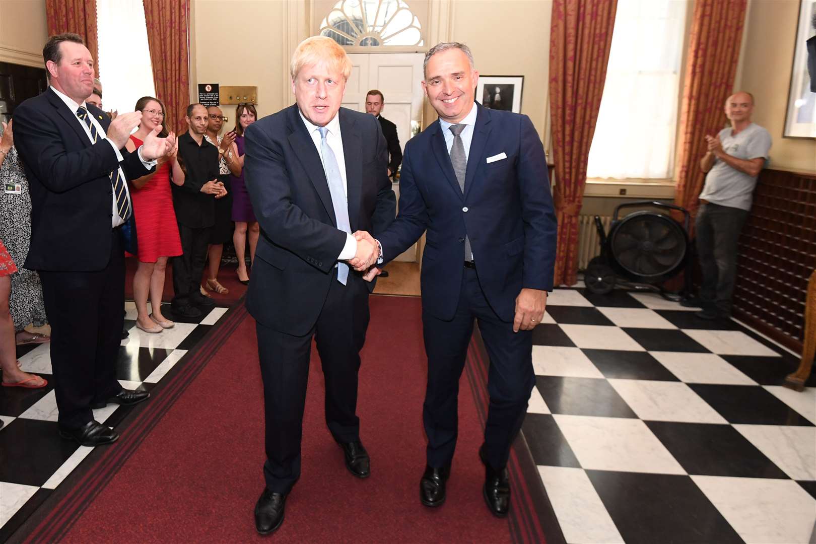 Sir Mark Sedwill welcoming Boris Johnson to No 10 on becoming Prime Minister – watched by Dominic Cummings, on the right (Stefan Rousseau/PA)