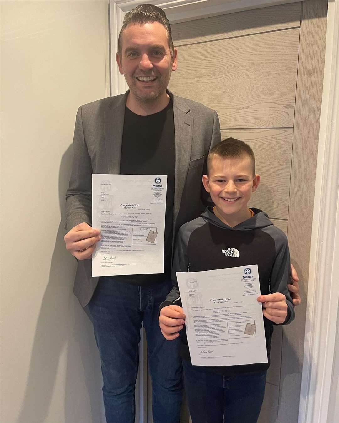 Stephen and Reiss with their Mensa result letters