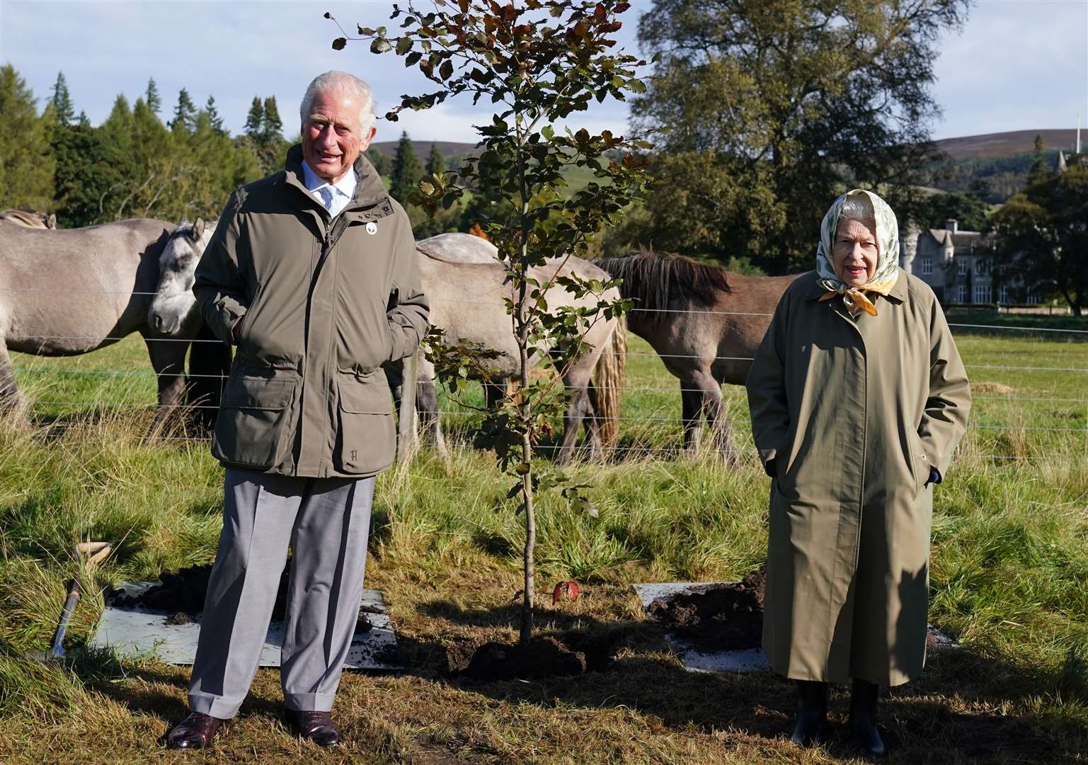 Charles and the Queen after planting a tree at Balmoral Cricket Pavilion to mark the Queen’s Green Canopy official planting season (Andrew MIlligan/PA)