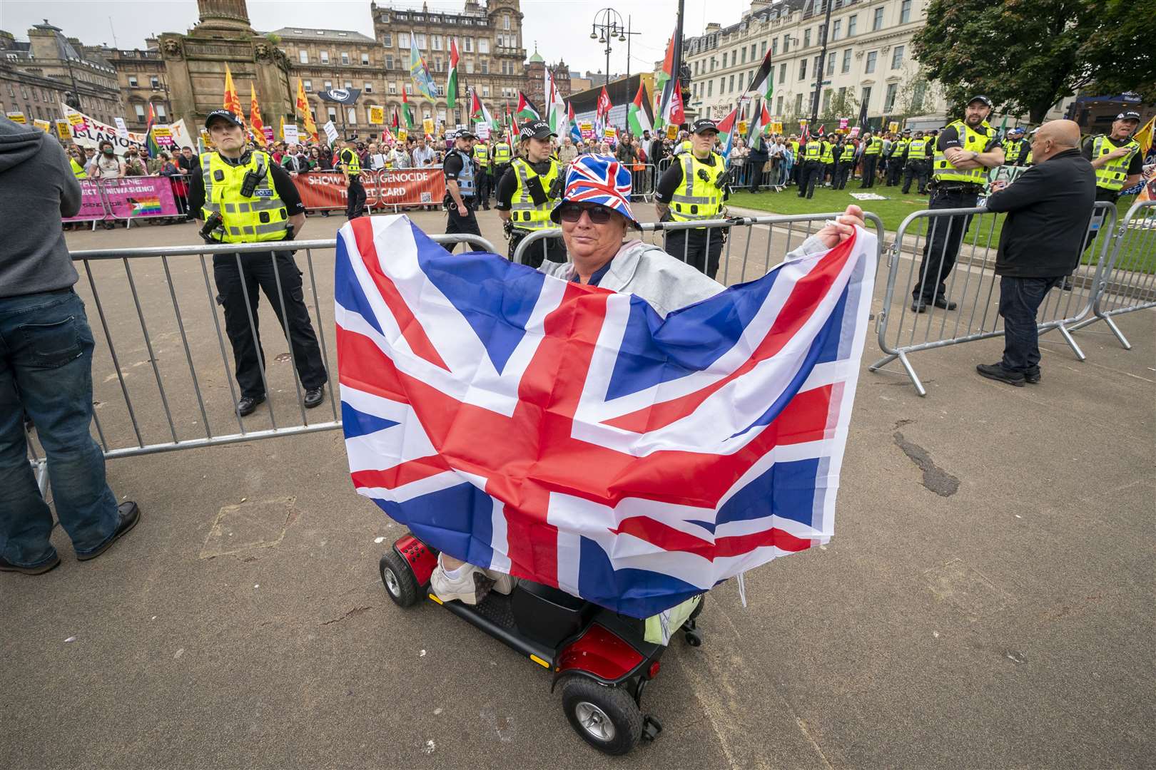 Supporters of a Pro-UK rally endorsed by Tommy Robinson gather in Glasgow’s George Square (Jane Barlow/PA)