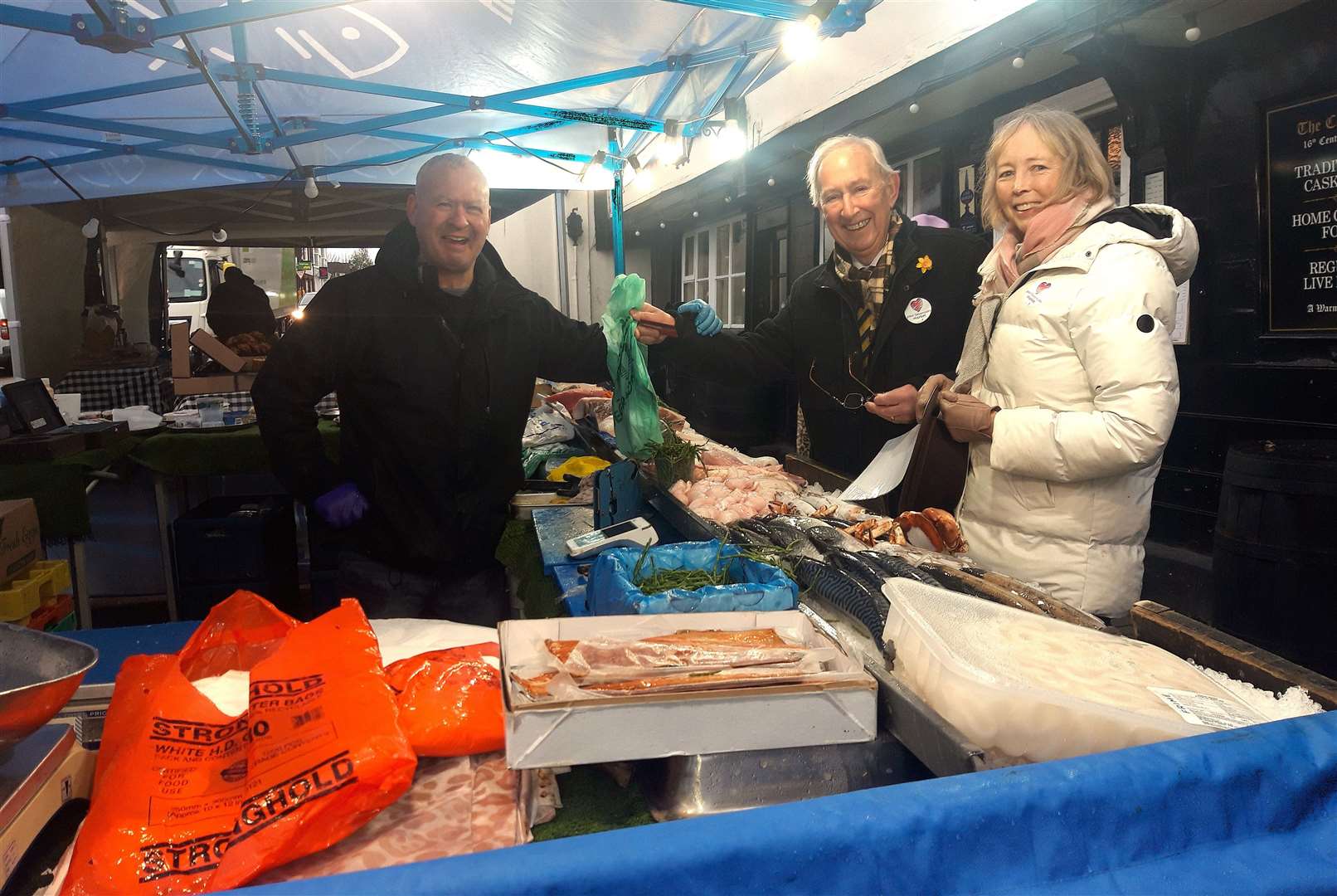 Deputy Mayor Tony Clayton stocks up on produce with third-generation fishmonger Paul James. Picture: Sevenoaks Town Council