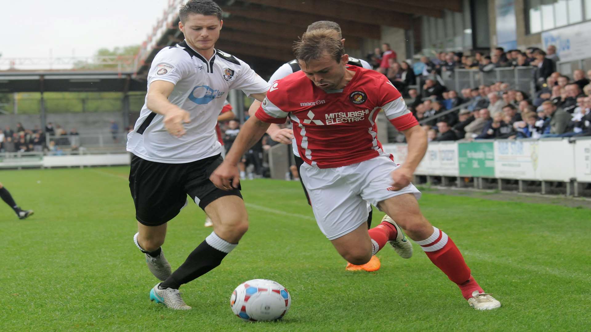 Ebbsfleet forward Matt Godden tries to find a way past Tom Gardiner Picture: Ruth Cuerden