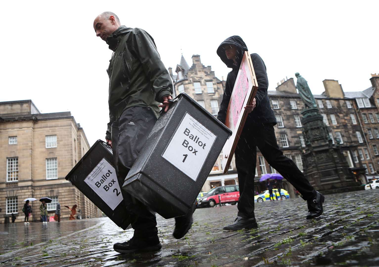 Polling station workers do a series of jobs on the day (Jane Barlow/PA)