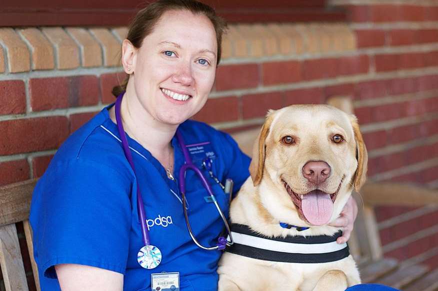 Buddy the labrador with PDSA nurse Jennie Keen