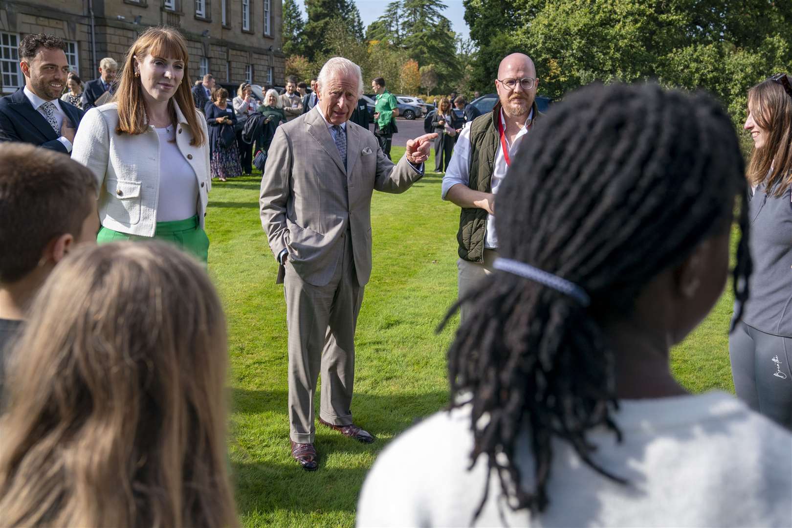 The King with Deputy Prime Minister Angela Rayner meets staff and students who have been taking part in woodland educational activities (Jane Barlow/PA)