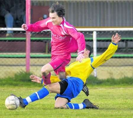 Hythe's Ben Sly rides a challenge against Slade Green