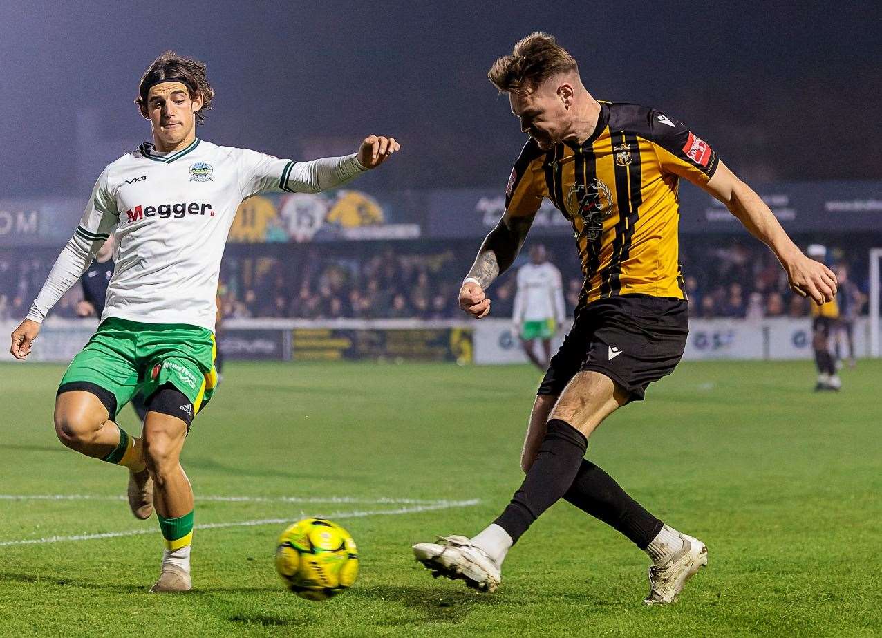 Folkestone midfielder Jack Jebb is closed down by Dover's George Wilkinson. Picture: Helen Cooper