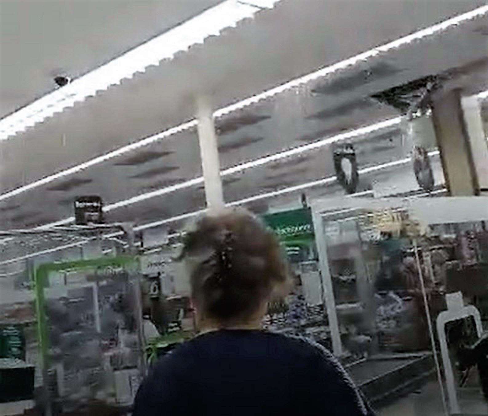 The moment more ceiling tiles fell through into the Morrisons store was caught on camera