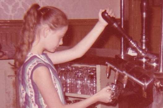 Angela Young pulling pints behind the bar of The Wheatsheaf in Gravesend, which was run by her parents Ernie and Pearl Pridmore in the 1950s and 60s