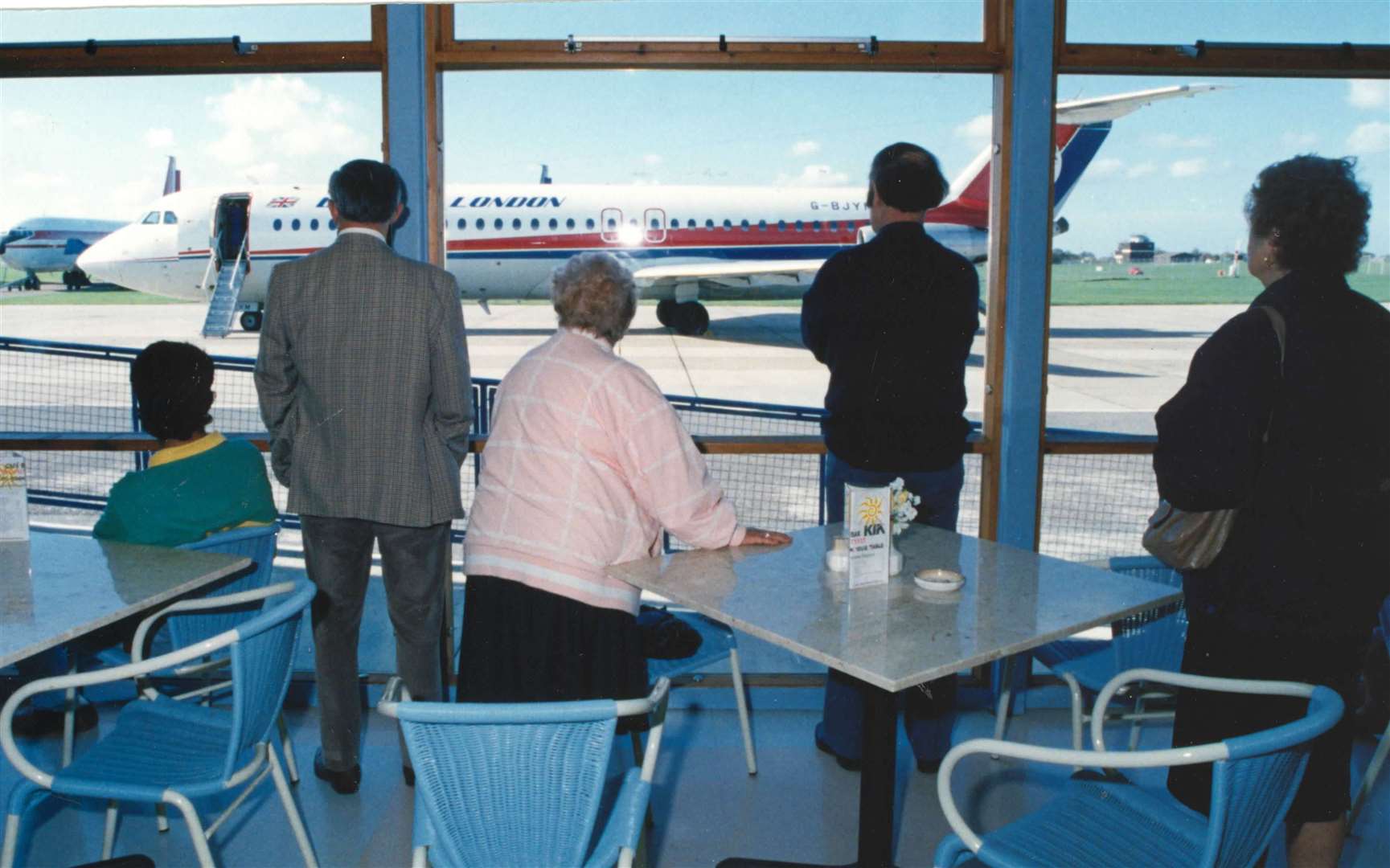 Passengers at the airport await their plane in 1990