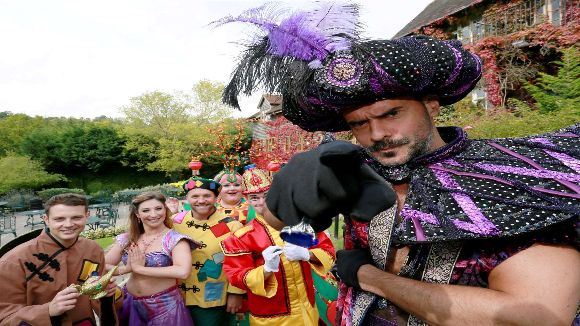 Michael Greco as Abanazar with the cast of Aladdin Picture: Phil Lee