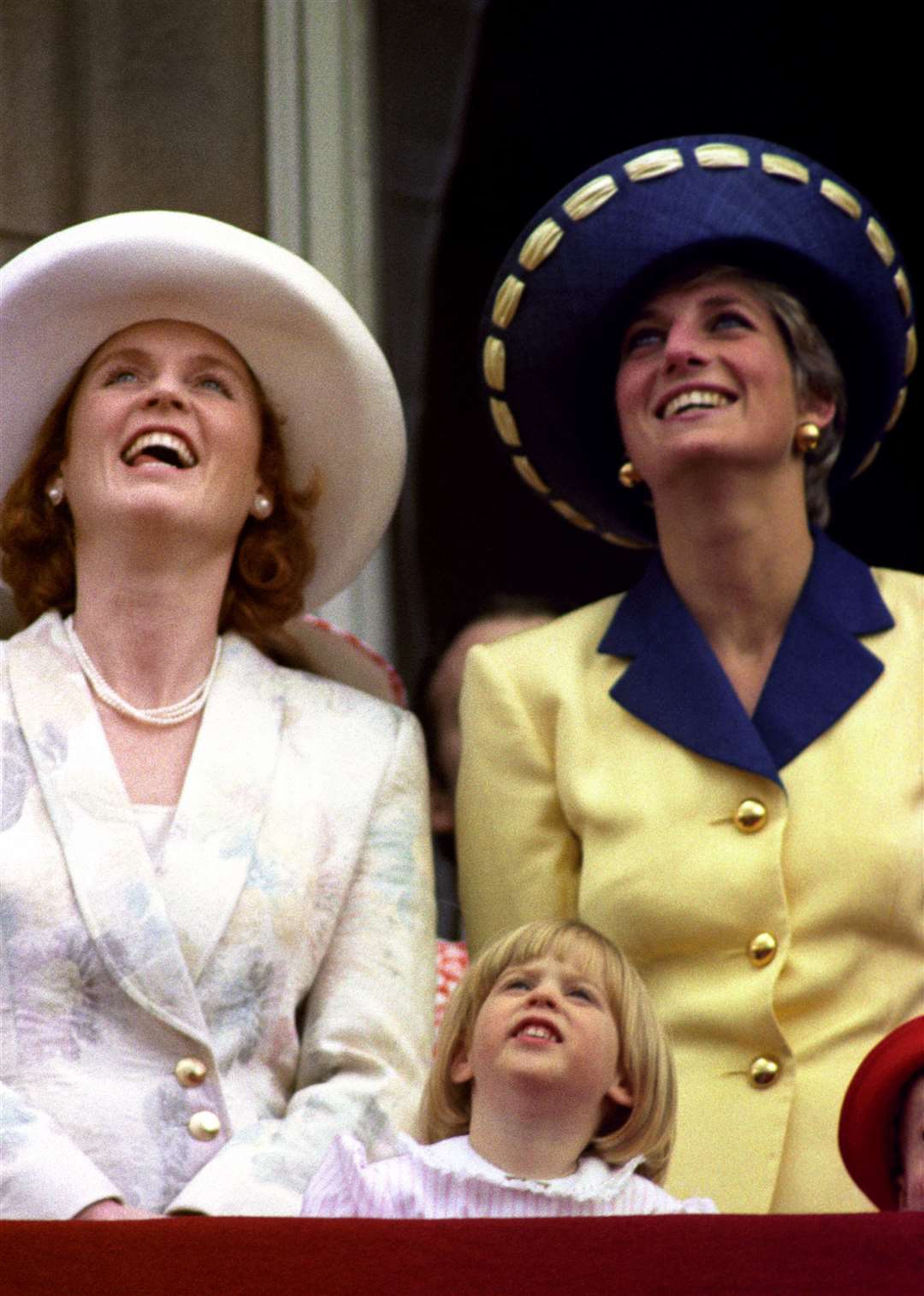 Sarah, Duchess of York, her daughter Beatrice and Diana, Princess of Wales watching a flypast from the balcony at Buckingham Palace (Martin Keene/PA)