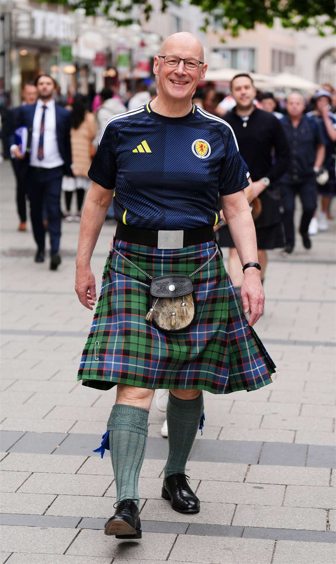 First Minister of Scotland John Swinney wearing a Scotland football shirt and a kilt at Marienplatz square, Munich, ahead of Scotland’s Euro 2024 match against hosts Germany (Andrew Milligan/PA)
