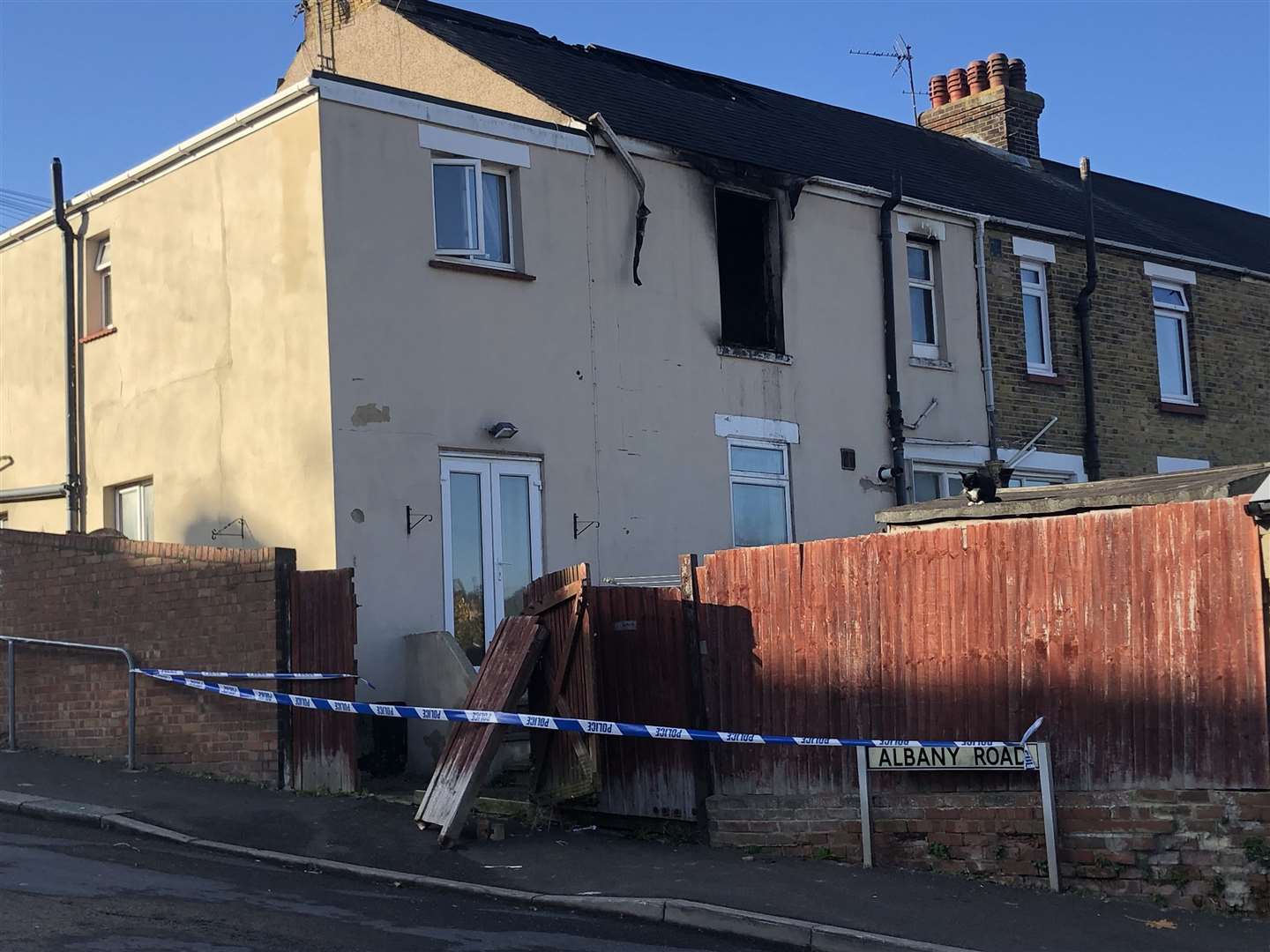 Police have cordoned off broken fencing in Albany Road