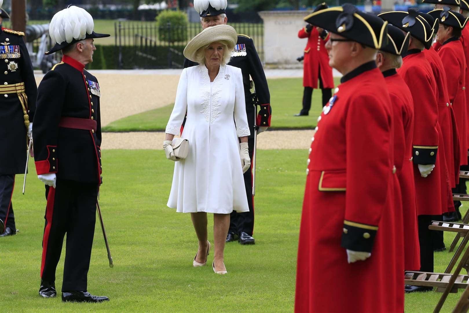 The Duchess of Cornwall inspected socially distanced Chelsea Pensioners in their famous scarlet coats and tricorn hats on parade in the central courtyard(Steve Reigate/Daily Express/PA)