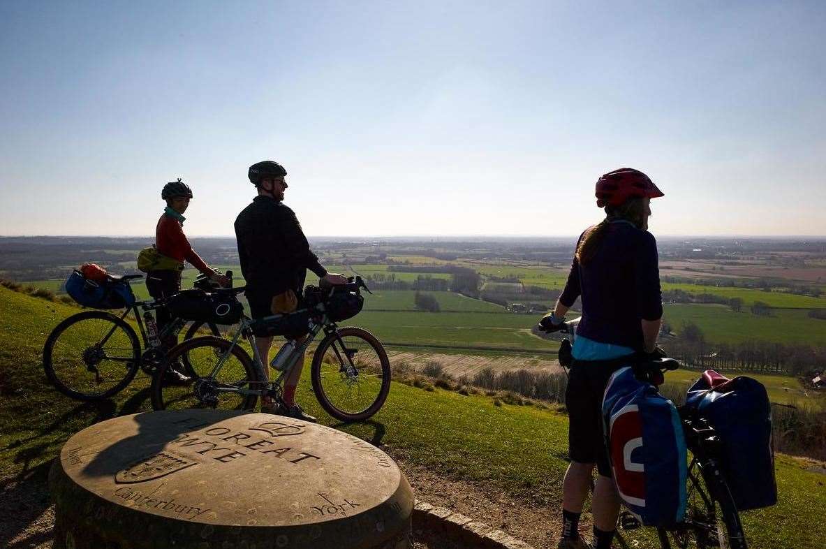Cyclists enjoy the fabulous views from above the Wye Crown on the Kent Downs