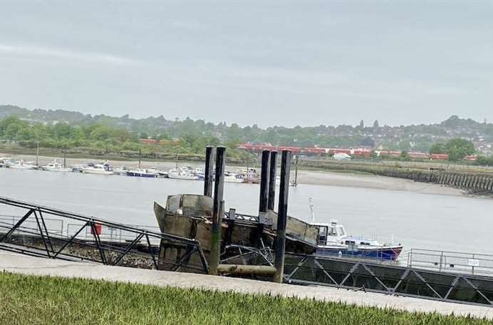 Historic Rochester Pier collapsed into the river mud bank