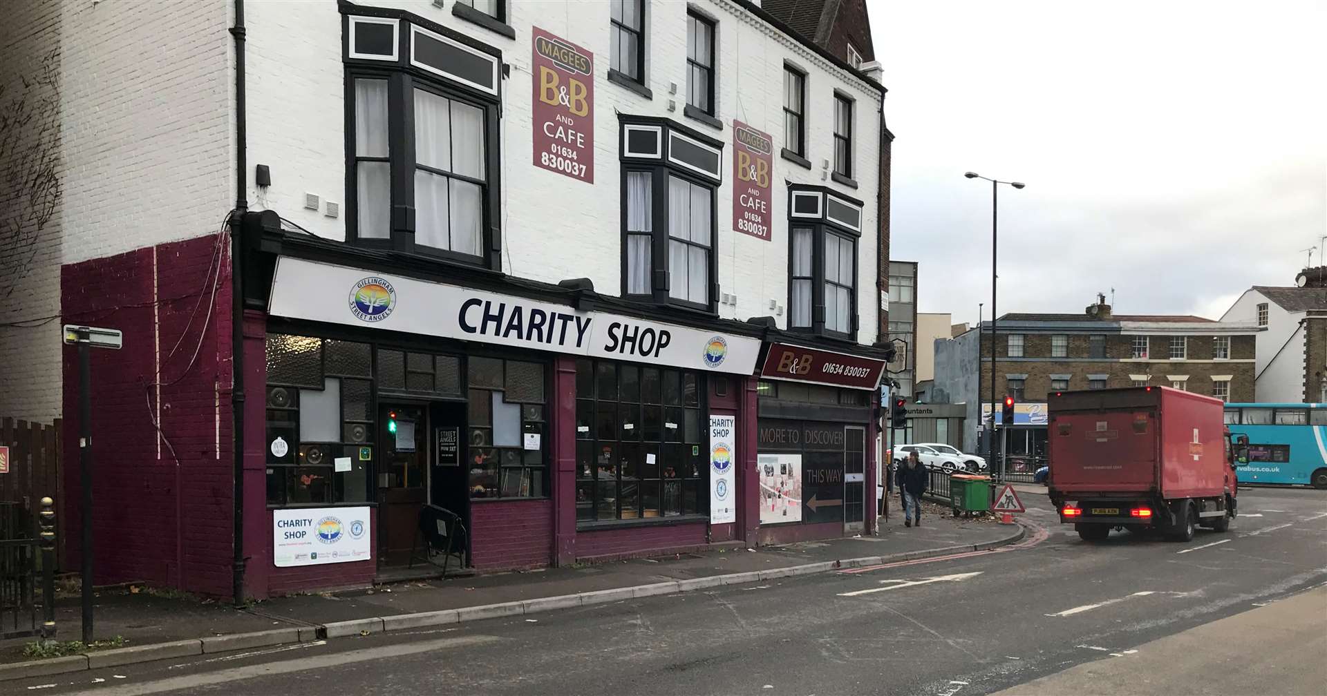 The "red routes" parking restriction has deterred customers from dropping off donations at the charity shop, according to the boss