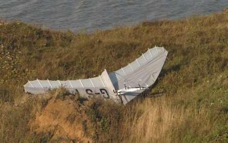 The detached wing of the microlight at the foot of the cliffs. Picture: MIKE SMITH