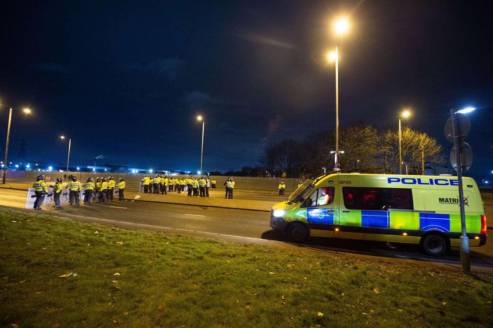 Police in riot gear after the demonstration outside the Suites Hotel in Knowsley, Merseyside (Peter Powell/PA)