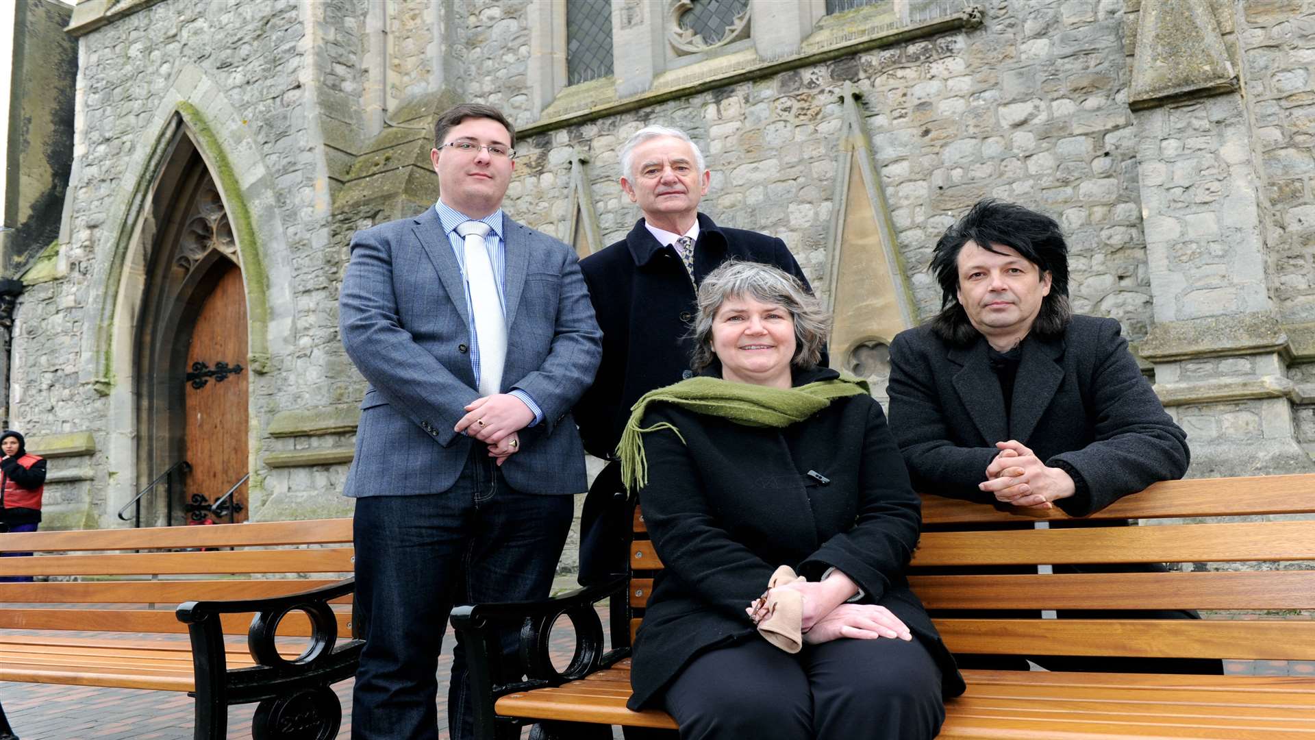 Cllr Lee Burgess, Cllr Roger Truelove and Cllr Mike Baldock commissioned grants for a High Street makeover. They are pictured with Sally Reeve from Baileys Coffee shop sitting on one of the new benches