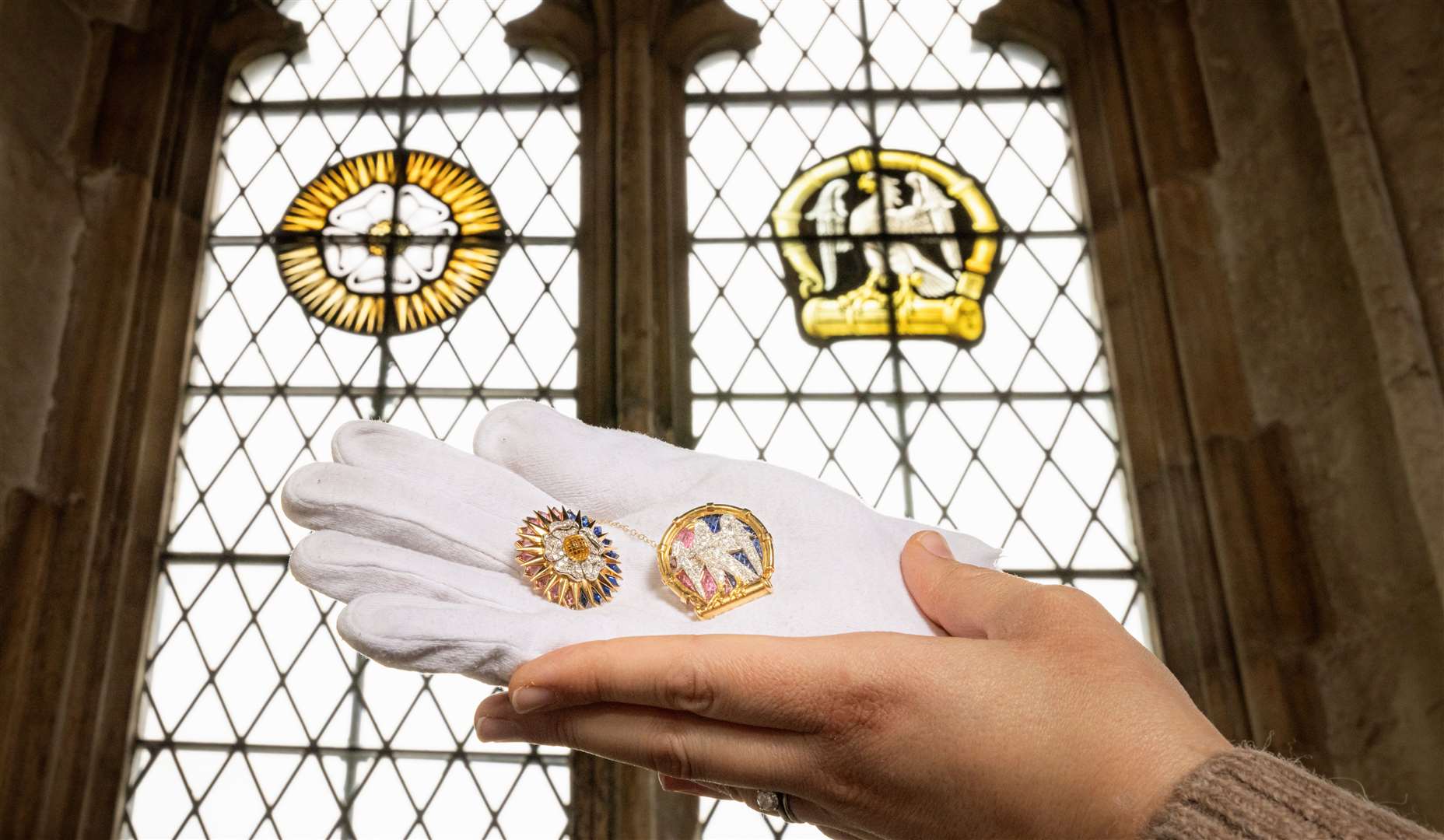 The brooches are going on display at Courtauld's former medieval palace home which has windows with a design similar to the jewellery. Image: English Heritage/PA